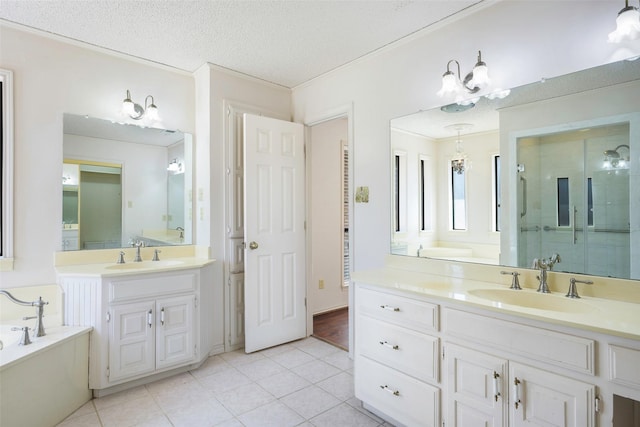 full bath with crown molding, a sink, and a textured ceiling