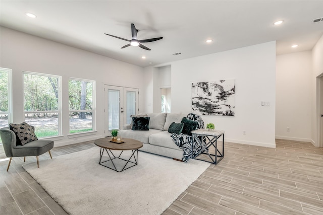 living area featuring recessed lighting, visible vents, baseboards, and wood finish floors