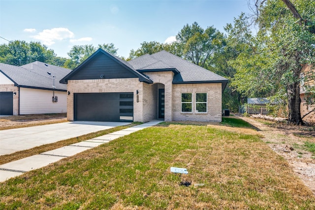 view of front of property featuring a garage, brick siding, concrete driveway, roof with shingles, and a front lawn