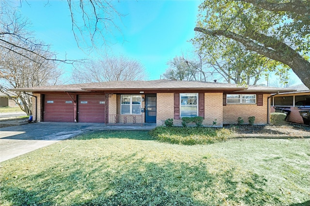 ranch-style home featuring driveway, a front lawn, and brick siding