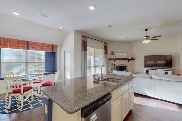 kitchen featuring a sink, visible vents, dark wood finished floors, and stainless steel dishwasher