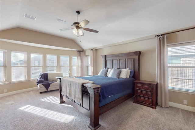 bedroom featuring carpet floors, multiple windows, and vaulted ceiling