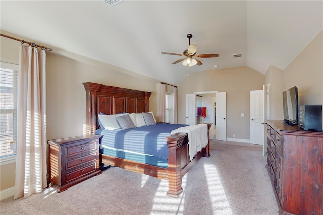 bedroom with visible vents, baseboards, vaulted ceiling, and light colored carpet