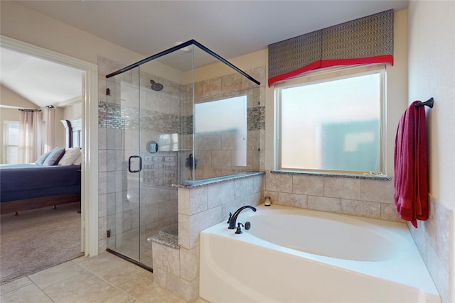 ensuite bathroom with ensuite bathroom, a stall shower, tile patterned flooring, and a garden tub