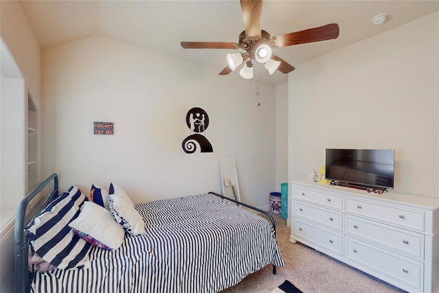 bedroom with a ceiling fan, lofted ceiling, and light colored carpet