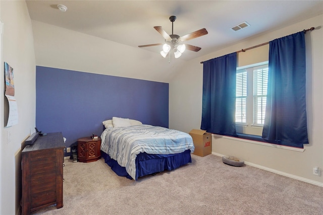 bedroom with baseboards, visible vents, a ceiling fan, vaulted ceiling, and carpet flooring