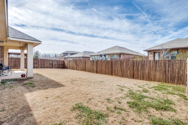 view of yard with a patio area and a fenced backyard