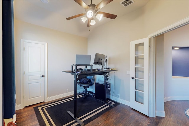 home office featuring baseboards, visible vents, lofted ceiling, ceiling fan, and wood finished floors