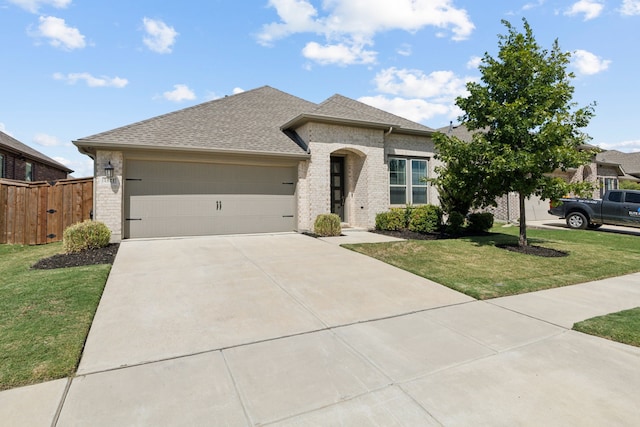 view of front of property with concrete driveway, brick siding, an attached garage, and a front lawn