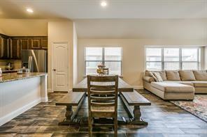 dining area with a wealth of natural light, baseboards, and recessed lighting