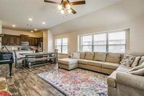 living room with lofted ceiling, a ceiling fan, wood finished floors, and recessed lighting