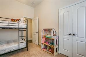 bedroom featuring carpet floors and a closet