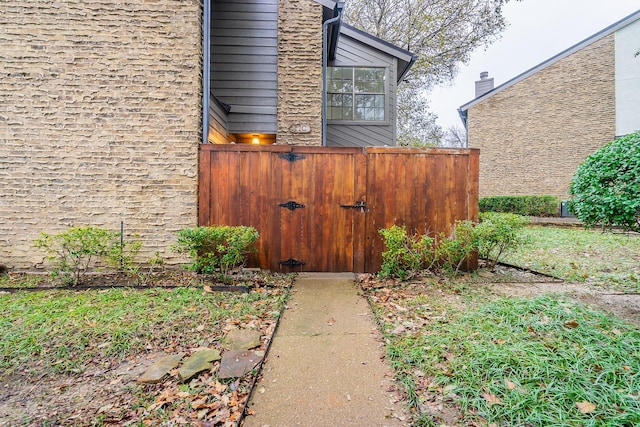 exterior space with a gate and fence