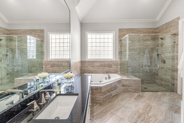 full bath featuring ornamental molding, vaulted ceiling, a sink, a shower stall, and a whirlpool tub