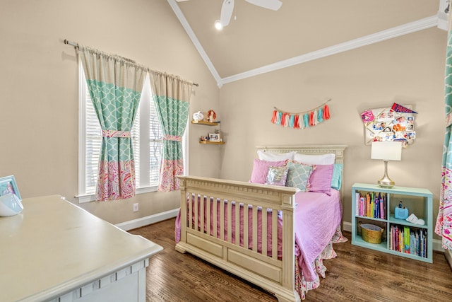 bedroom featuring lofted ceiling, wood finished floors, a ceiling fan, baseboards, and crown molding