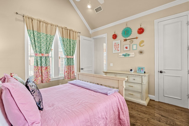 bedroom featuring crown molding, visible vents, vaulted ceiling, and wood finished floors