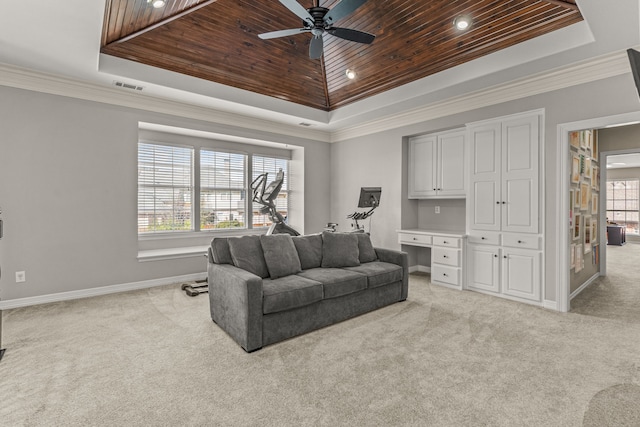 living room with a tray ceiling, wood ceiling, and built in desk