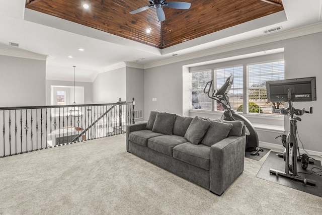 exercise area with a raised ceiling, wooden ceiling, and visible vents