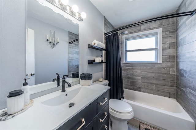 bathroom with shower / tub combo, vanity, and toilet