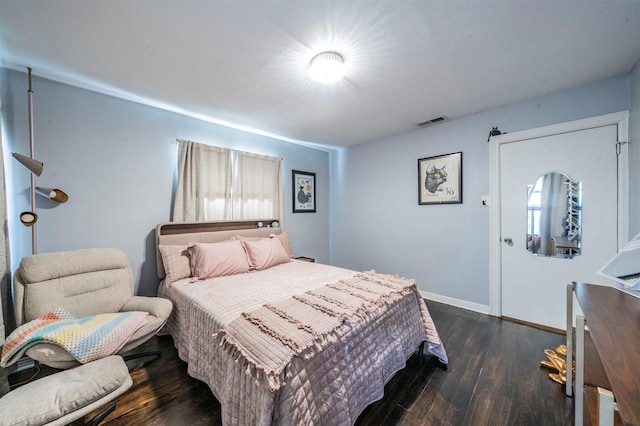 1216 Fuller Dr, Dallas, TX 75218 - bedroom featuring baseboards, visible vents, and dark wood-type flooring