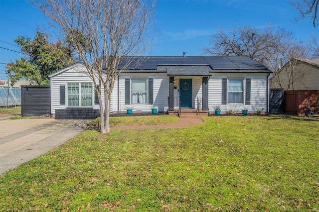 1216 Fuller Dr, Dallas, TX 75218 - view of front facade featuring a shingled roof, a front lawn, fence, and roof mounted solar panels