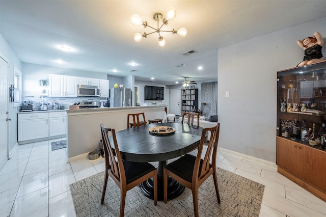 dining space featuring ceiling fan with notable chandelier, light tile patterned floors, visible vents, and recessed lighting