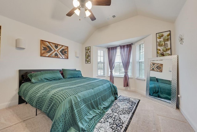 bedroom with lofted ceiling, carpet, visible vents, and baseboards