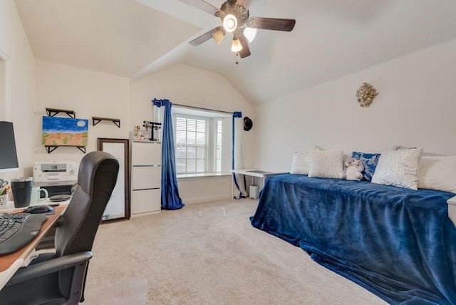 carpeted bedroom with vaulted ceiling, a ceiling fan, and baseboards