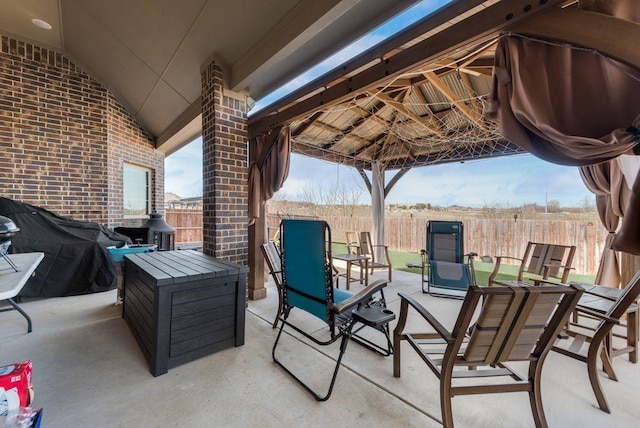 view of patio / terrace with a gazebo and fence