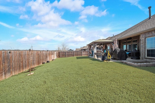 view of yard featuring a patio area, a fenced backyard, and a gazebo