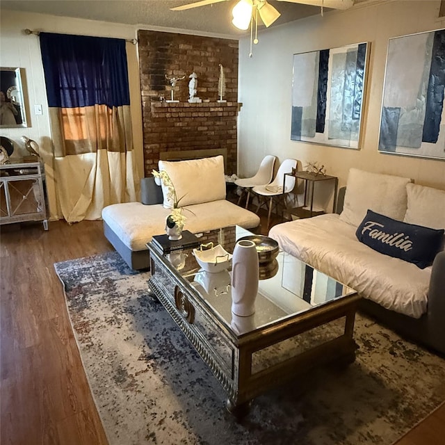 living area with ceiling fan and wood finished floors