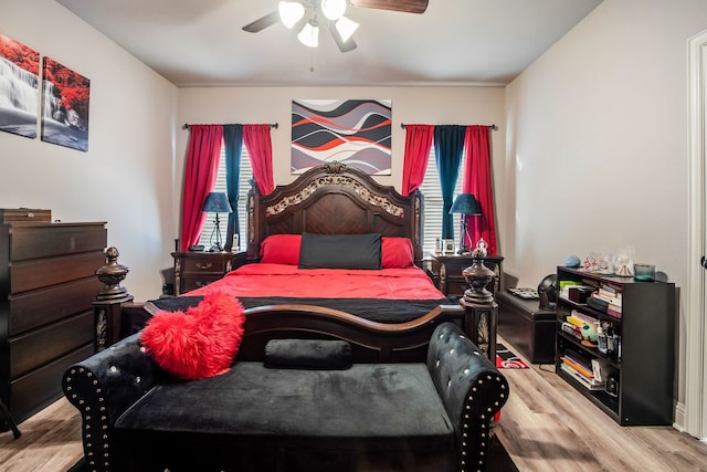 bedroom with a ceiling fan and wood finished floors