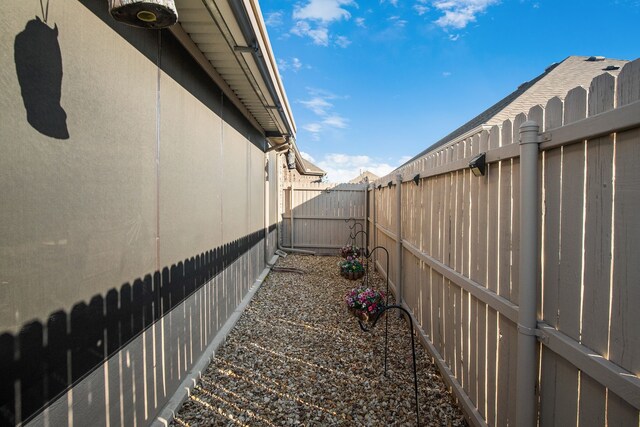 view of home's exterior with a fenced backyard and stucco siding