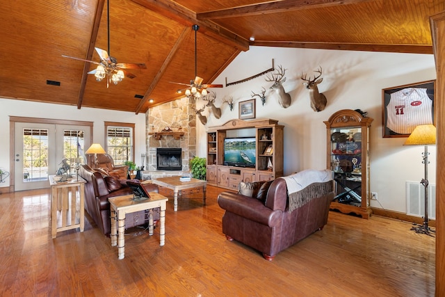 living room with wooden ceiling, visible vents, and wood finished floors