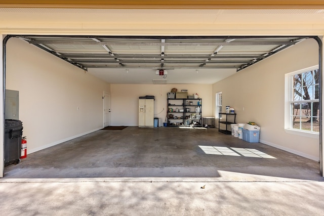 garage featuring baseboards and a garage door opener