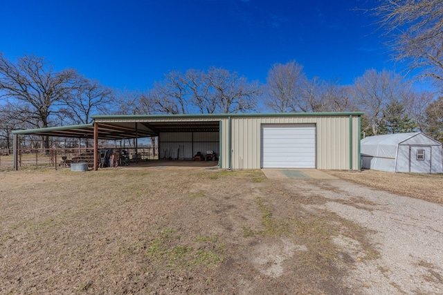 view of outbuilding with an outbuilding and driveway