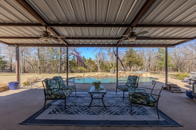 view of patio with an outdoor pool, a ceiling fan, and a hot tub