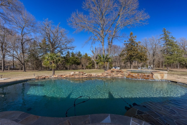 pool with an in ground hot tub