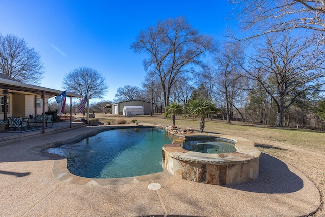 view of pool featuring a pool with connected hot tub, an outbuilding, a lawn, and a patio