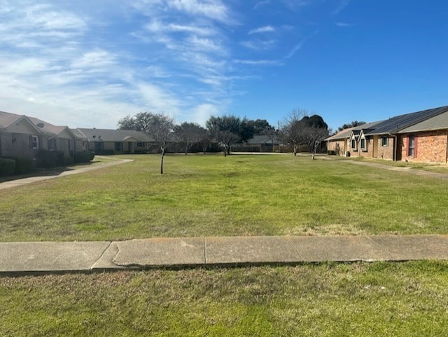 view of yard featuring a residential view