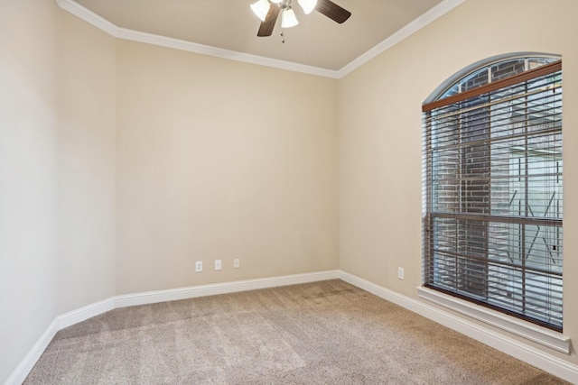 unfurnished room with carpet flooring, crown molding, and baseboards