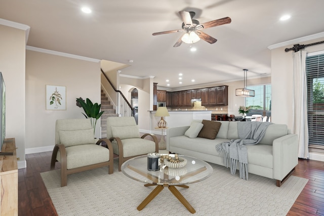 living room featuring recessed lighting, baseboards, crown molding, and hardwood / wood-style floors