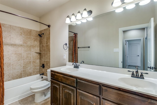 full bathroom with toilet, shower / bath combo with shower curtain, a sink, and tile patterned floors