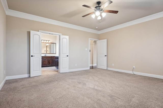 unfurnished bedroom featuring ornamental molding, light carpet, and baseboards