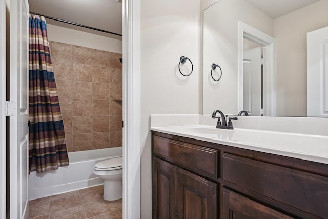 bathroom with toilet, tile patterned floors, shower / tub combo with curtain, and vanity