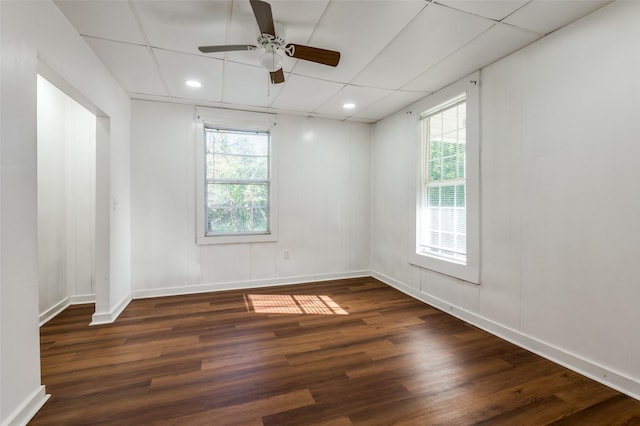 spare room featuring recessed lighting, wood finished floors, a ceiling fan, and baseboards