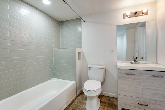 full bath with bathtub / shower combination, toilet, wood finished floors, vanity, and baseboards