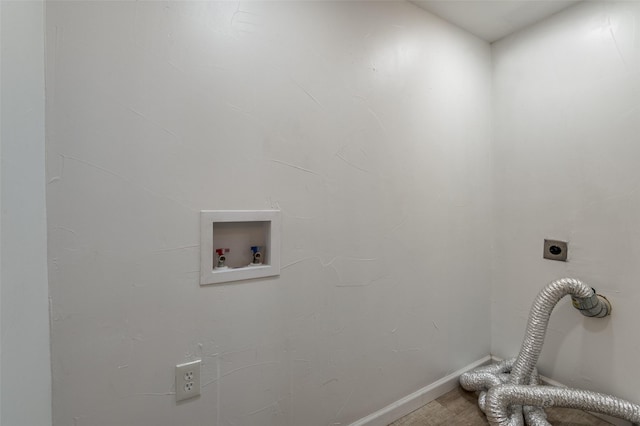 clothes washing area with washer hookup, laundry area, hookup for an electric dryer, and baseboards