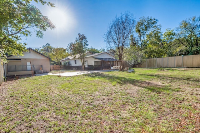 view of yard with a patio and a fenced backyard