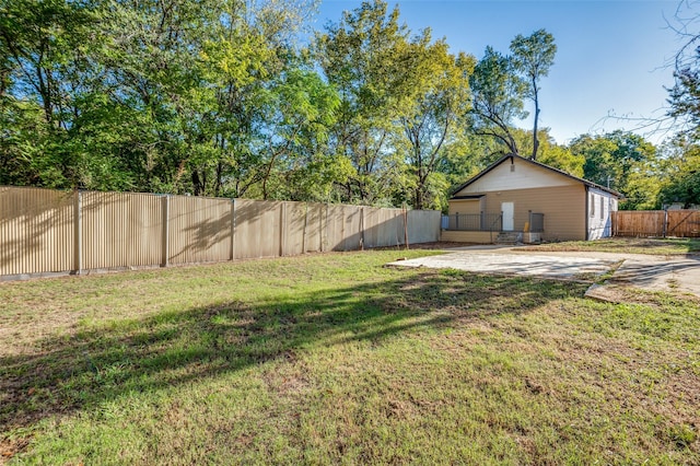 view of yard with a fenced backyard and a patio